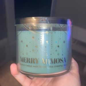 Bath and body works merry mimosa candle.